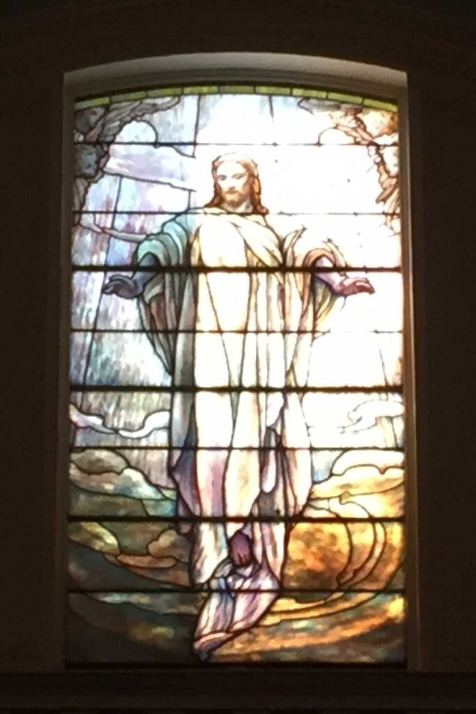 Stained glass window showing Jesus Ascension